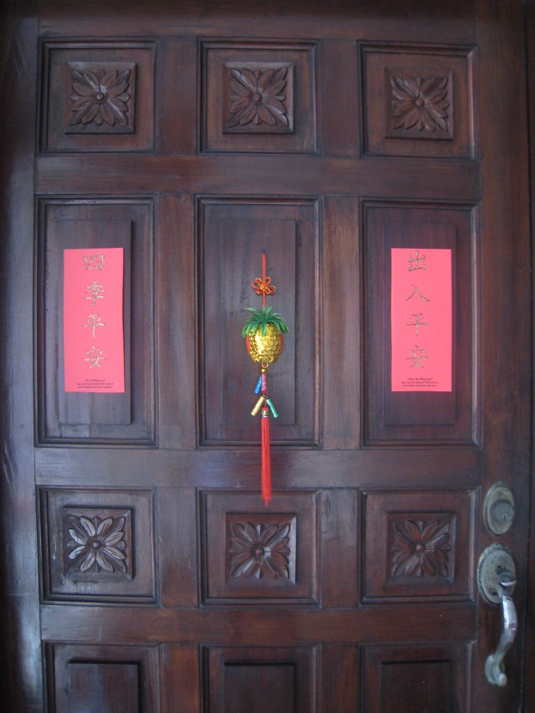 Our main door with the couplet on both sides to wish good luck for the people living inside