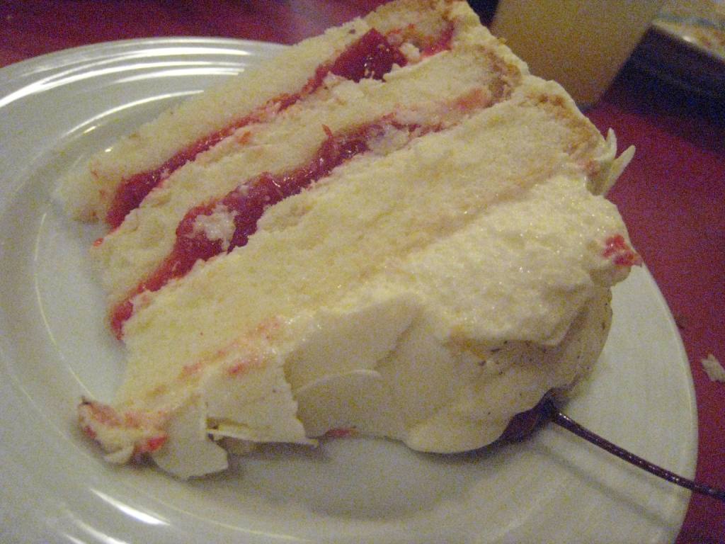 See how nothing was spared to fill the innards of this cake with cream & cherry bits? Yummy!